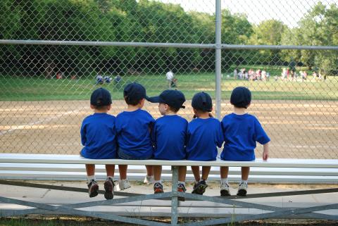 Young baseball players sitting on bench